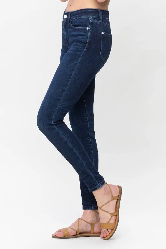 mid-rise-skinny-jeans-in-dark-blue